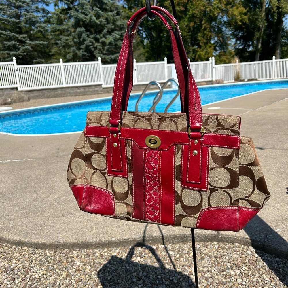 Brown coach bag with red leather